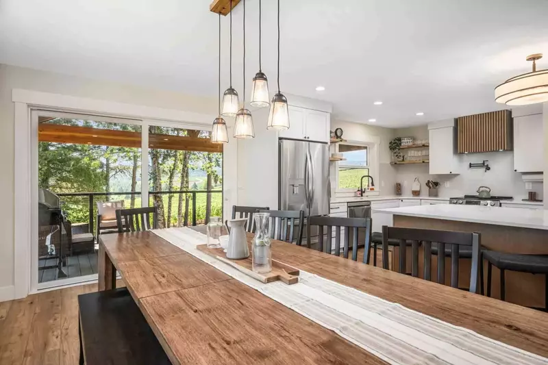 Plenty of room to enjoy meals on the harvest table in dining area.