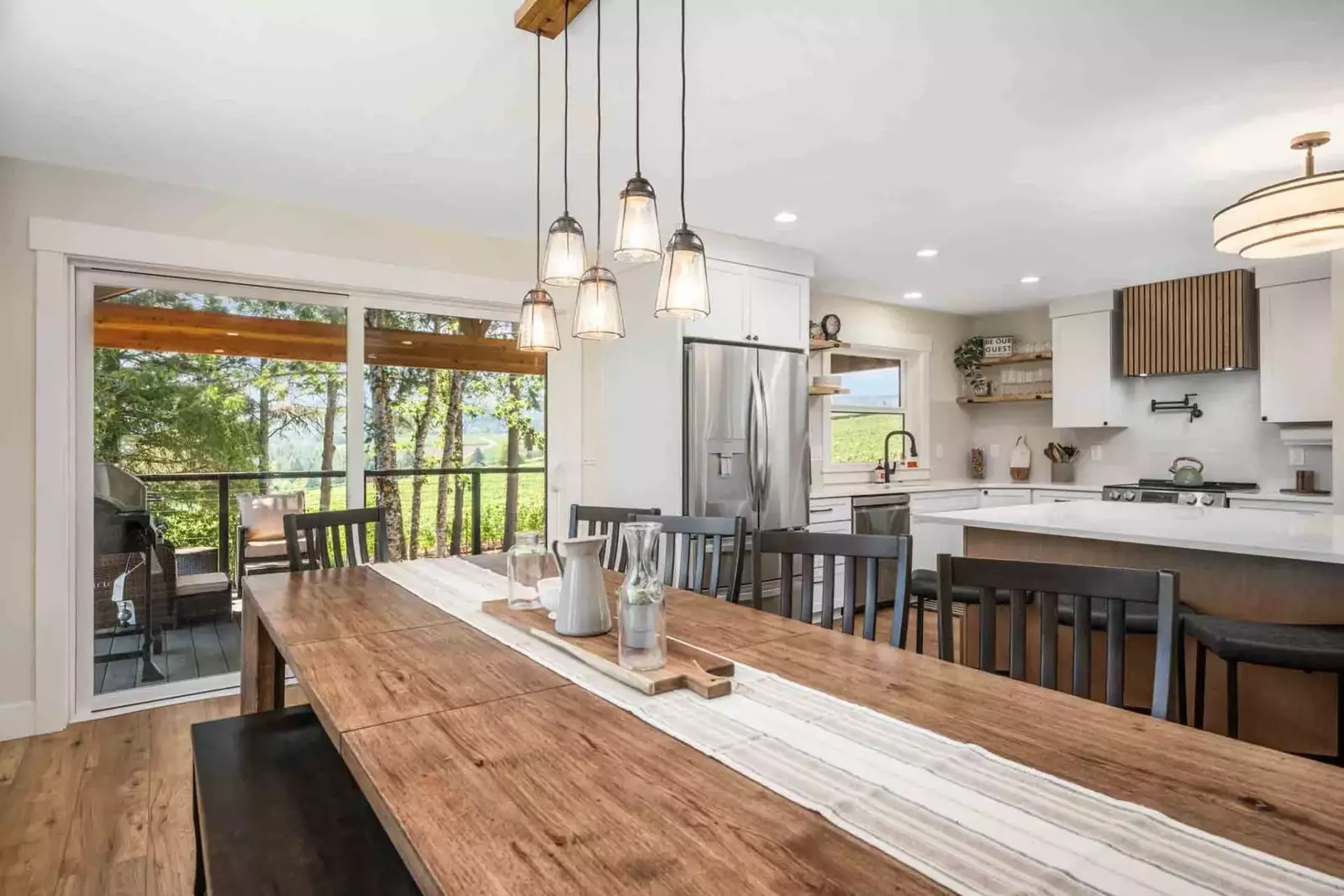 Plenty of room to enjoy meals on the harvest table in dining area.