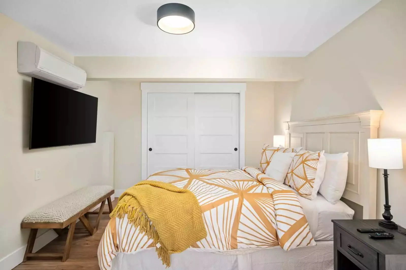 Bedroom with king bed on the lower floor includes individually controlled AC & Heat and Smart TV along with an en suite bathroom