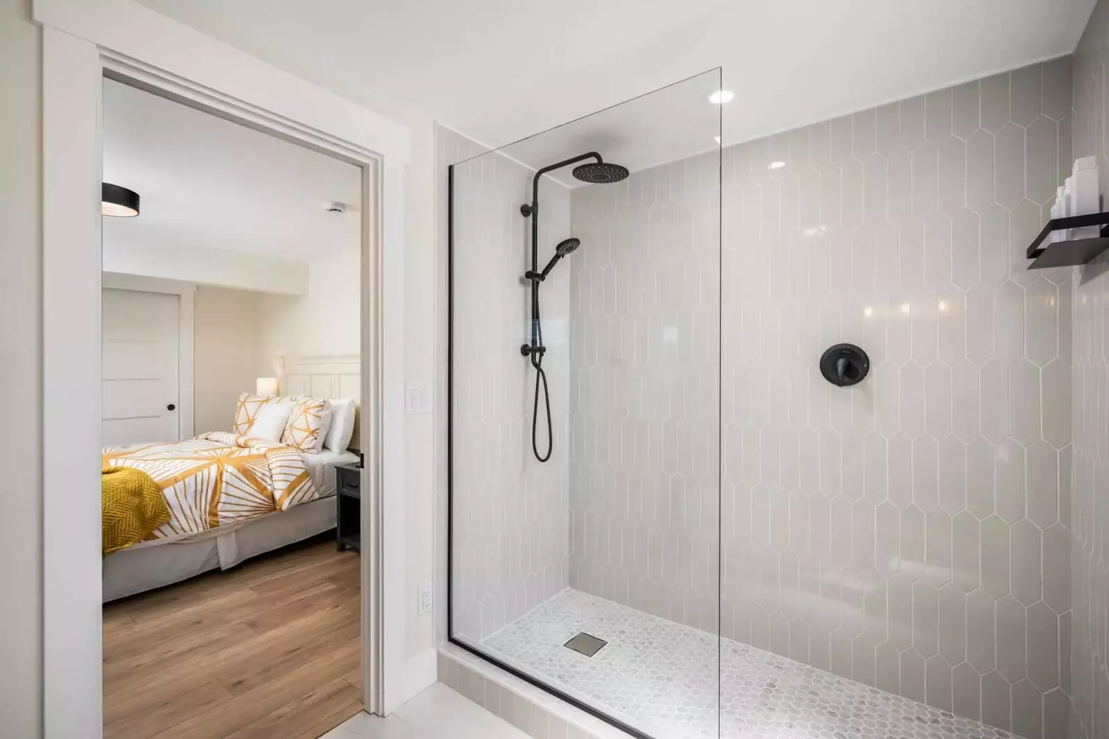 En suite bathroom with large tile work.