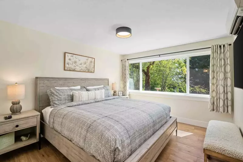 Bedroom with king bed on the lower floor includes individually controlled AC & Heat and Smart TV full bathroom just outside the door