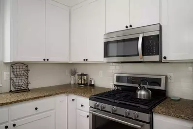 The kitchen has ample counter space and up to date appliances.