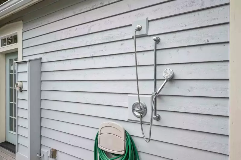 An outdoor shower to wash off in after a fun day on the beach.