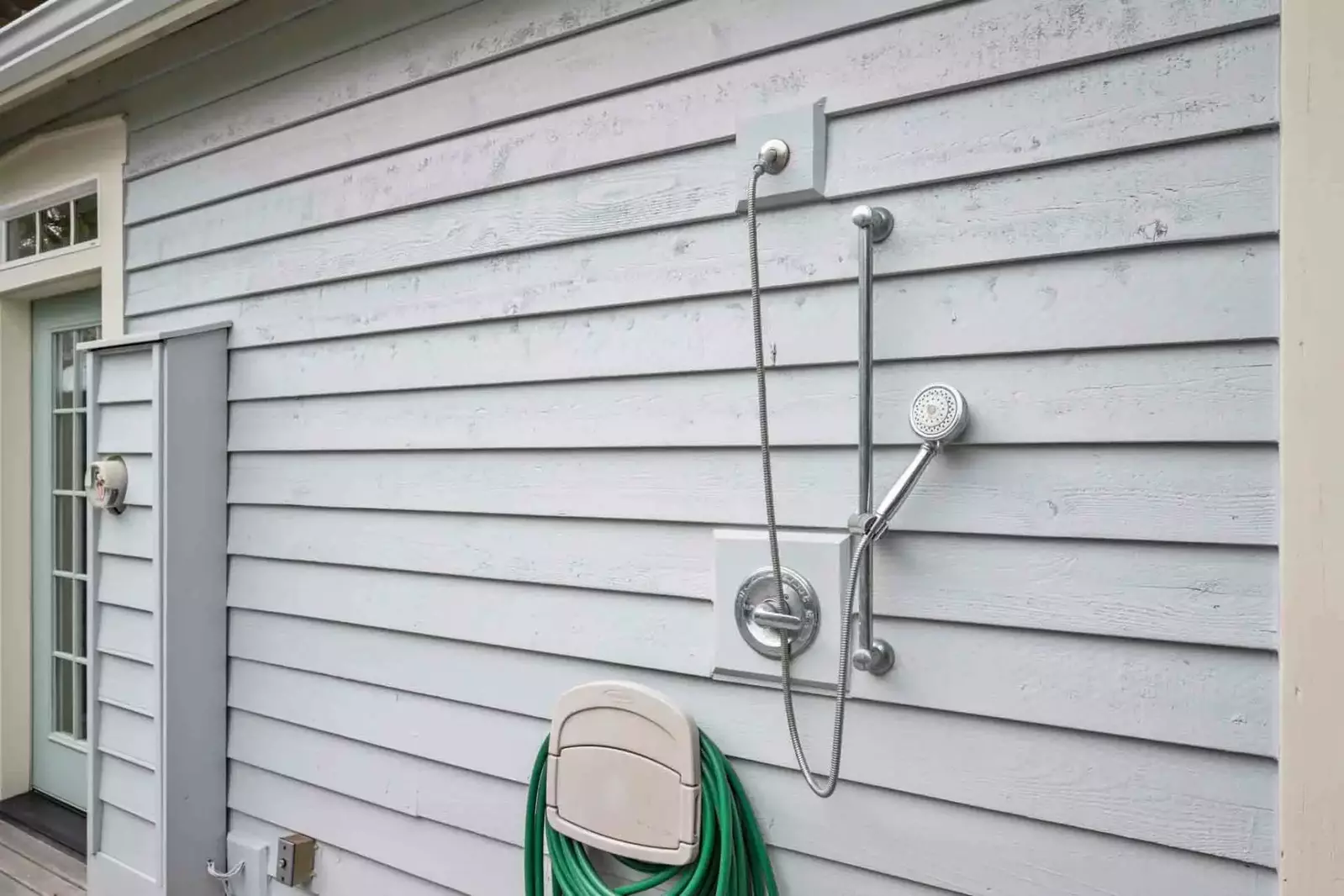 An outdoor shower to wash off in after a fun day on the beach.