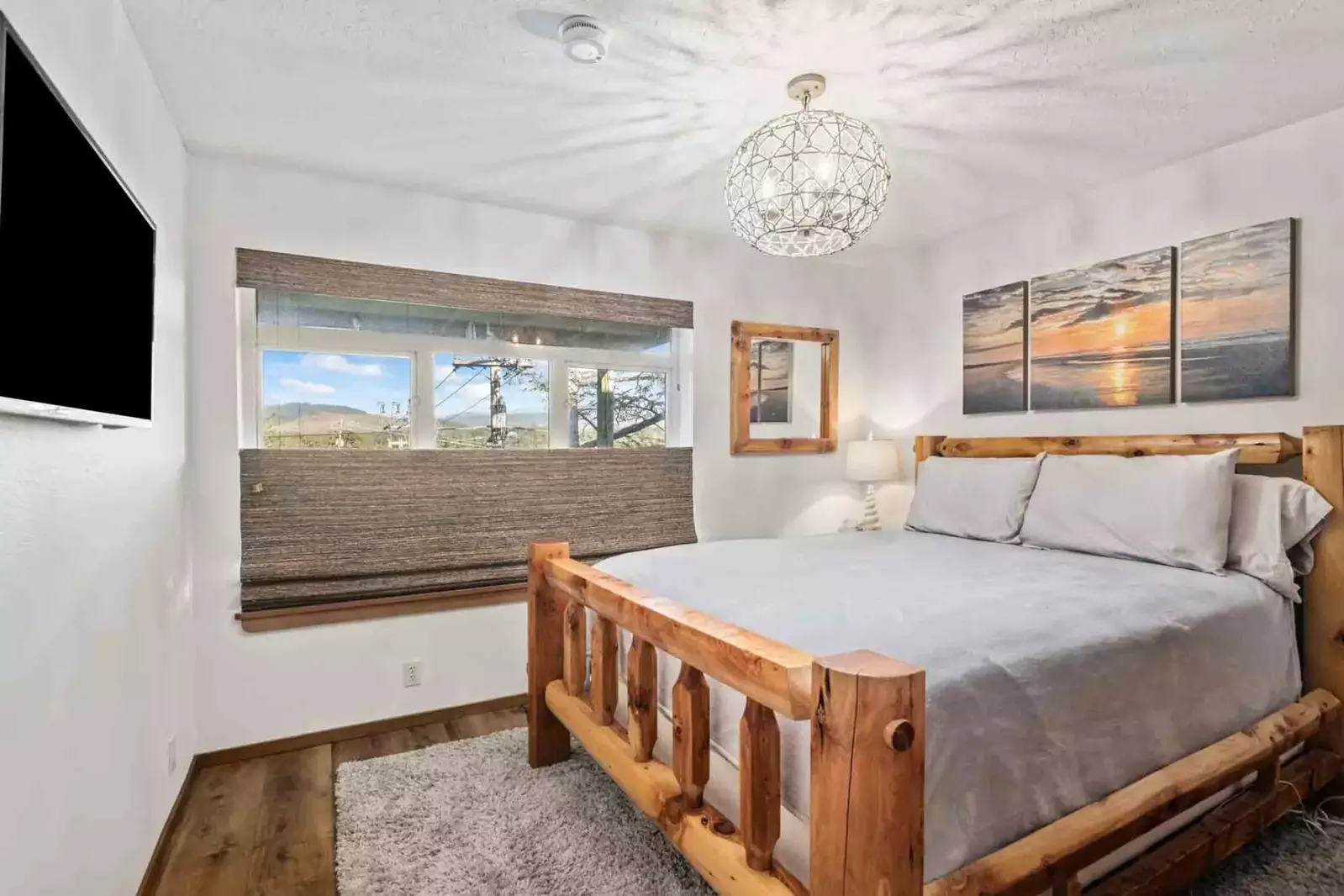 Another bedroom with a comfy bed and a smart tv.