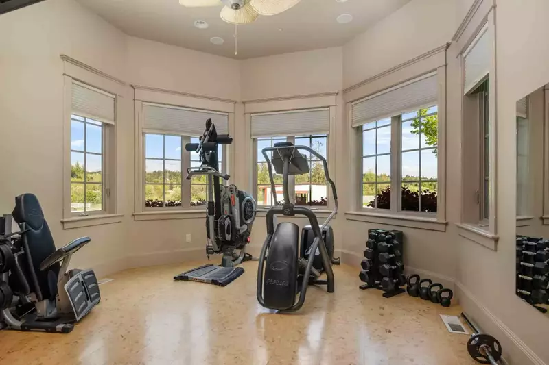 Enjoy a full work out in the personal gym. This space has multiple machines and weights.