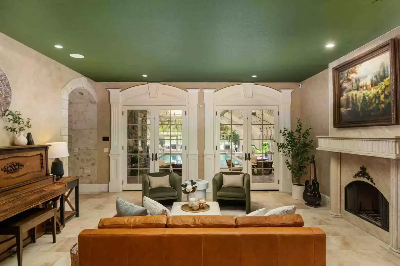 Another cozy room with a fireplace. This one leads right to the pool!