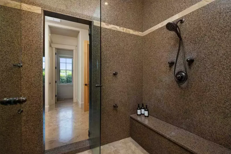 The shower is spacious, up to date, and has excellent water pressure.