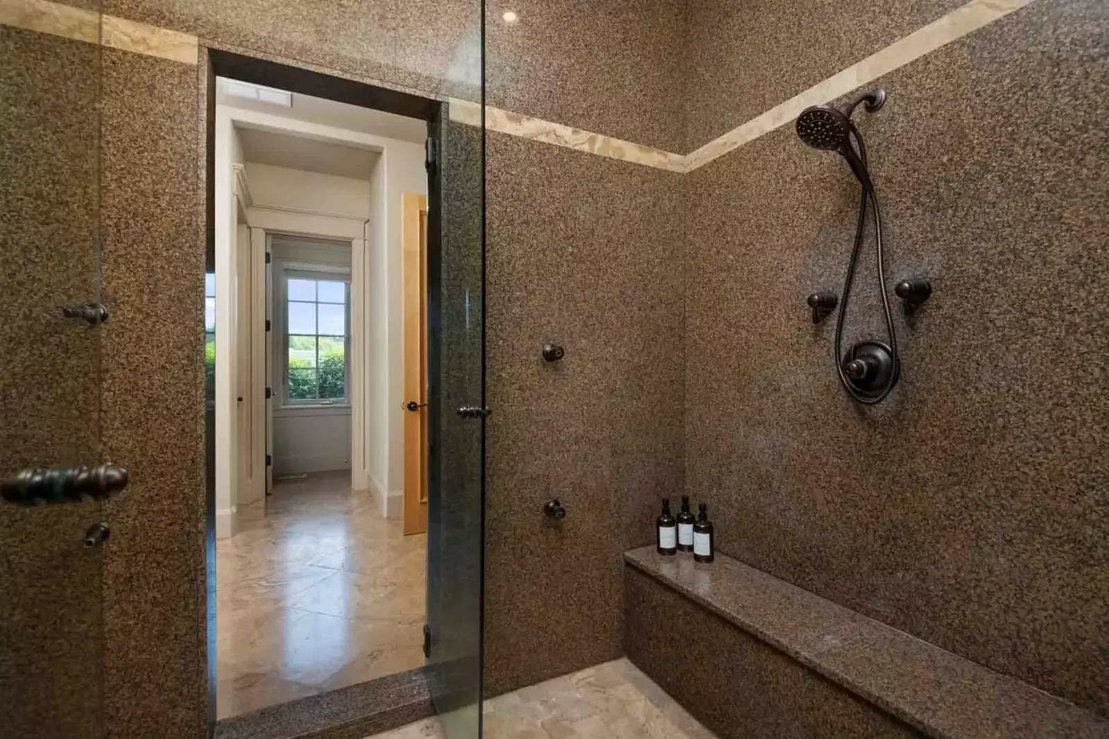 The shower is spacious, up to date, and has excellent water pressure.