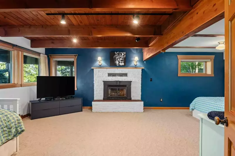 Have a movie night in this room while relaxing in front of a cozy fire.