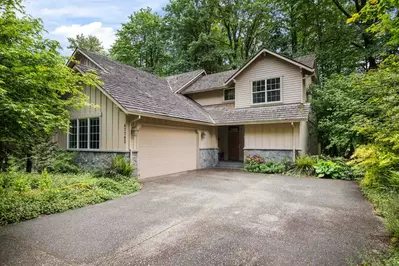 The driveway and road are plowed during winter.