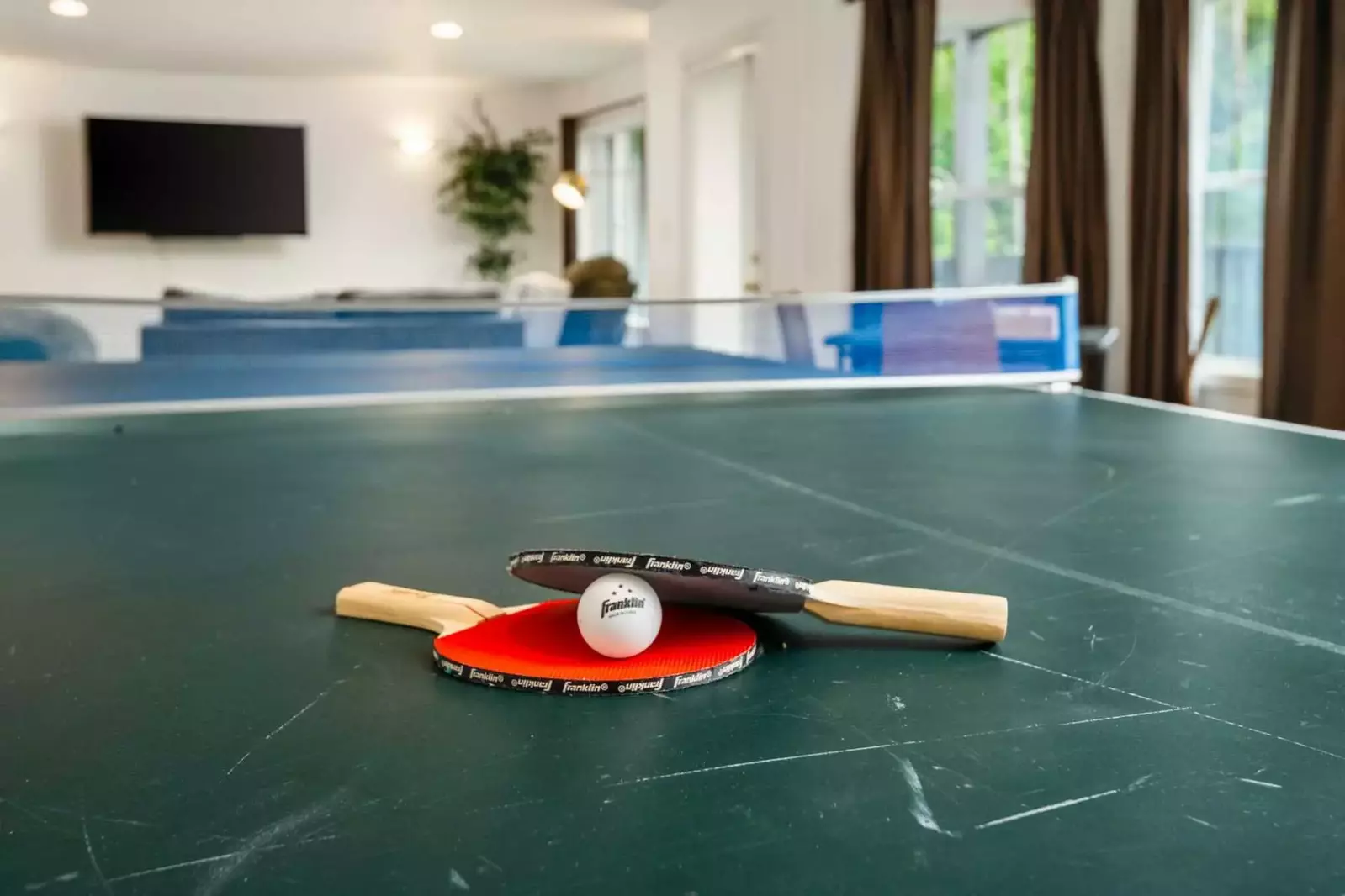 Enjoy the smart tv as you wait for your turn at ping pong.