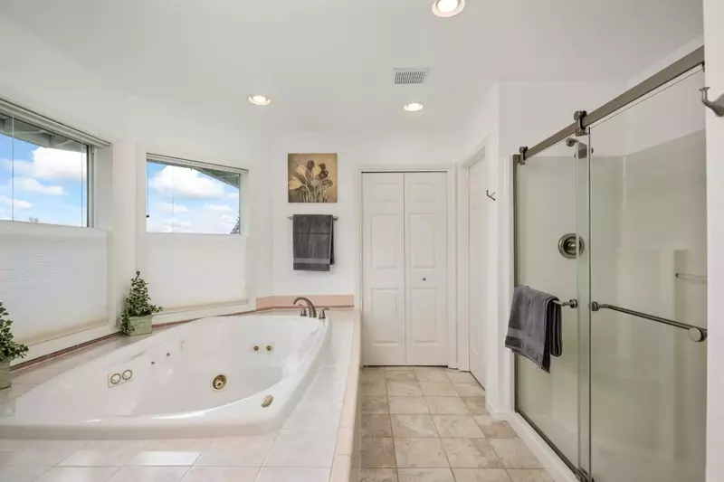 The bath tub has jacuzzi jets.