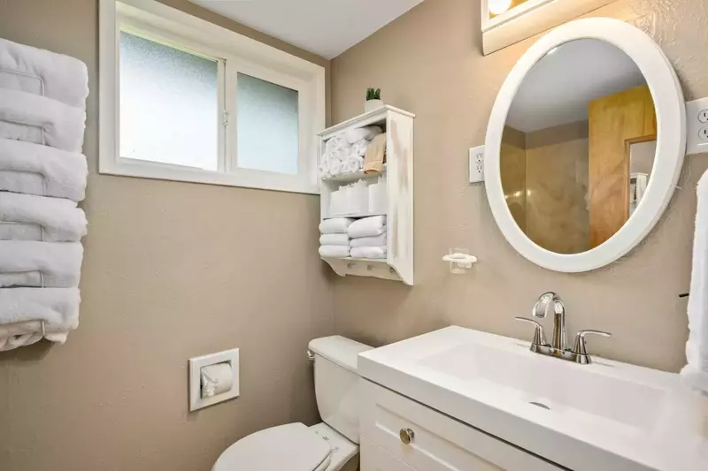 The bathroom is recently updated and ornately decorated.