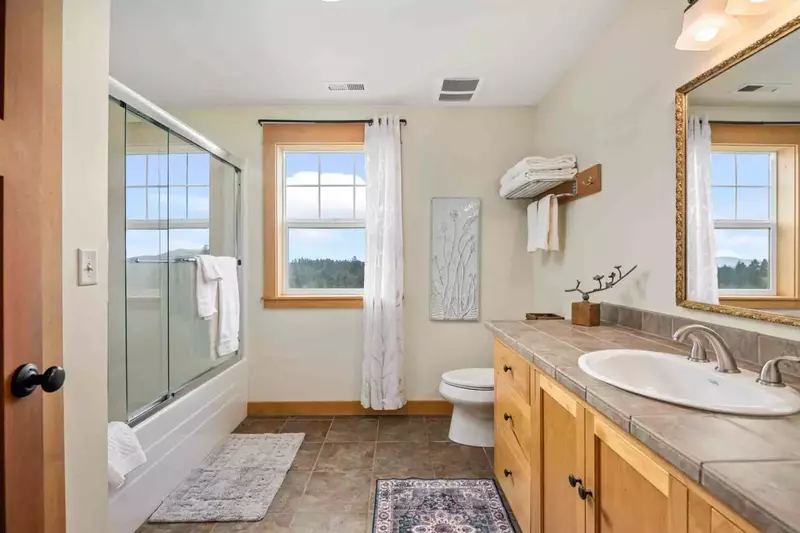 The bathroom is recently updated and decorated.