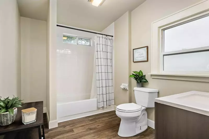 Newly remodeled bathroom with a combo tub and shower.