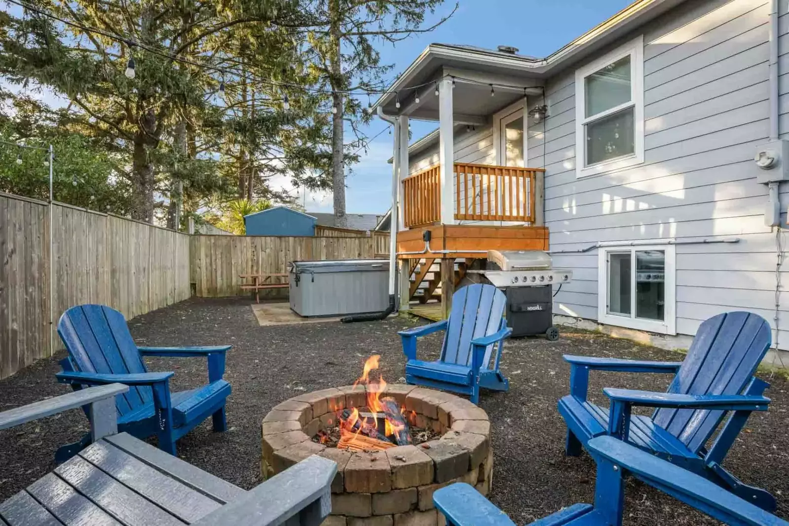 The patio area has a fire pit. bbq, hot tub, and plenty of space to relax.