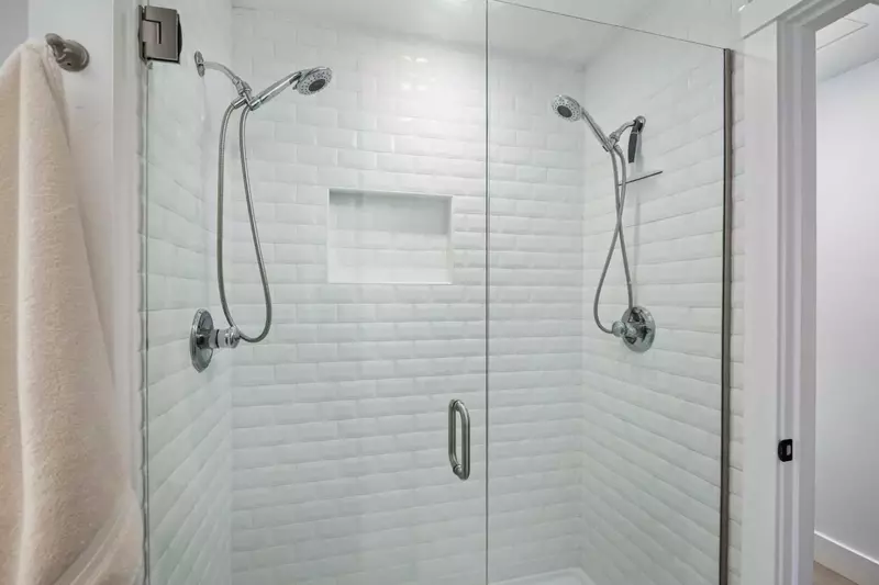 The shower is spacious, up to date, and has excellent water pressure.