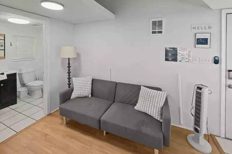 A comfy sofa bed in the center of the unit.