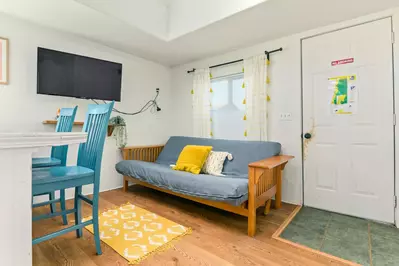 A sofa bed with a smart TV.