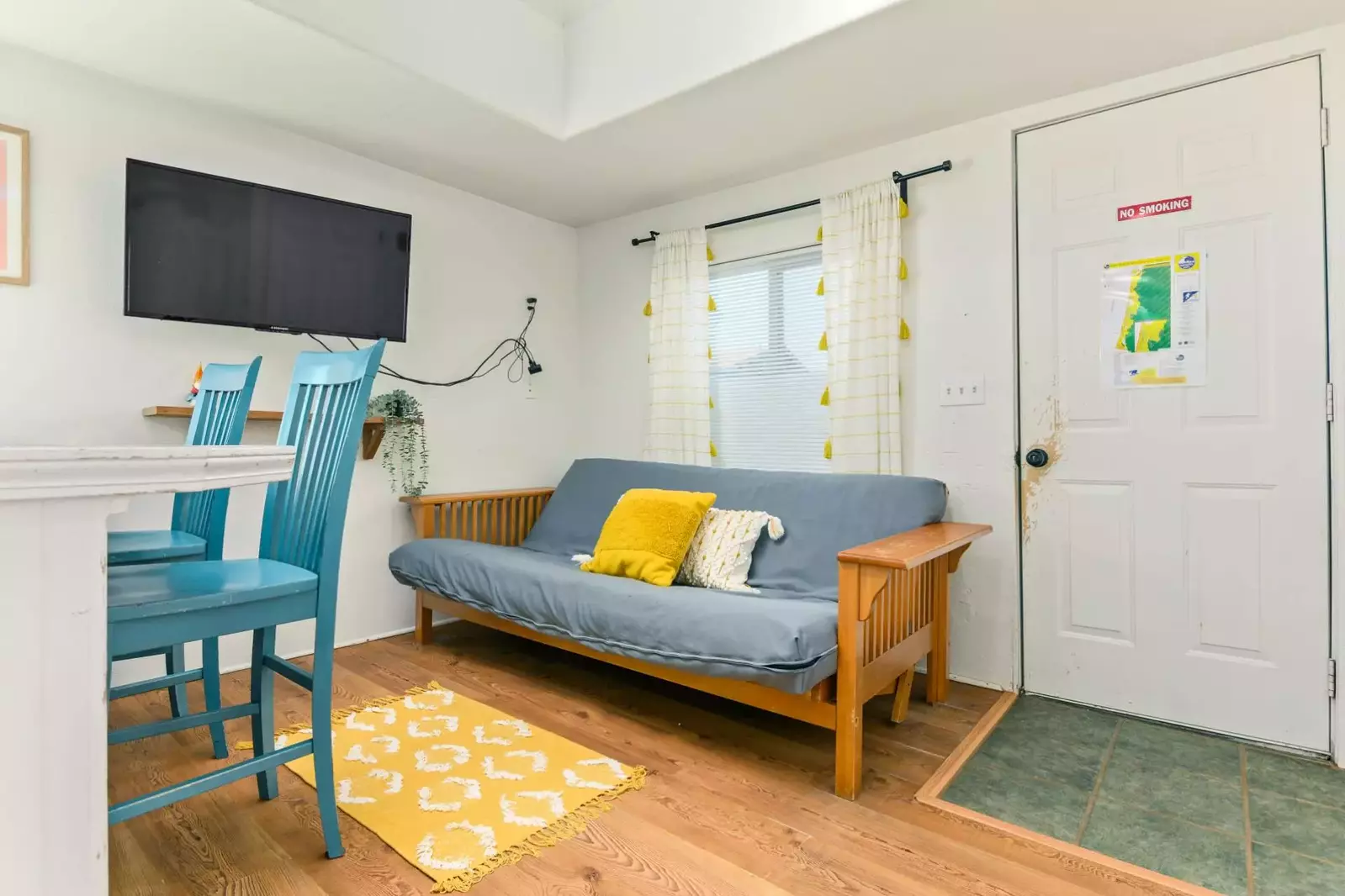 A sofa bed with a smart TV.