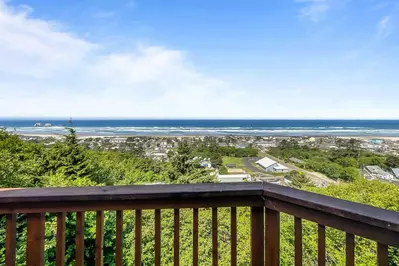 Enjoy views of Rockaway Beach from the deck and inside this rental.