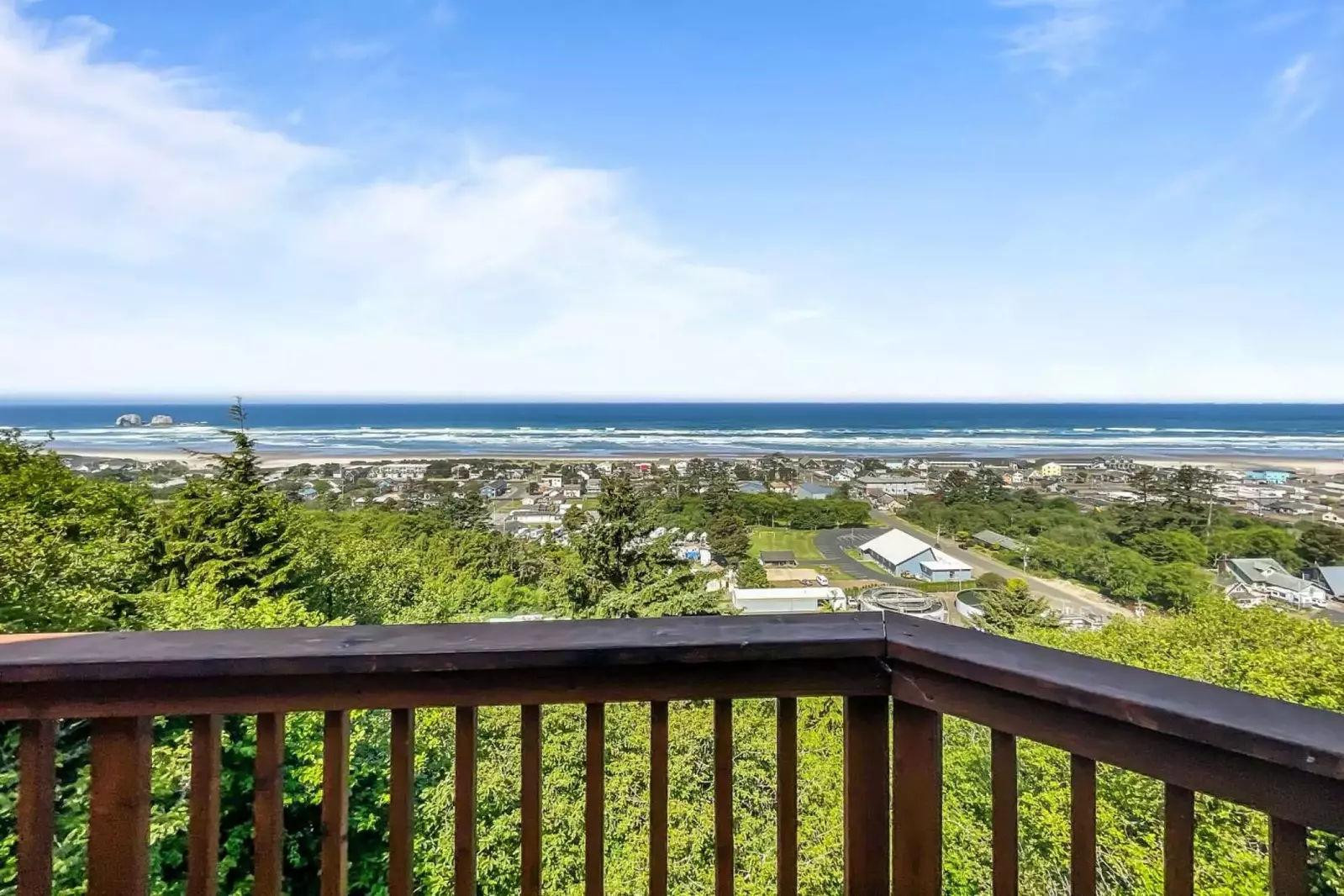 Enjoy views of Rockaway Beach from the deck and inside this rental.