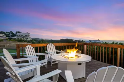 Enjoy the views and fresh ocean air while relaxing around the fire table.