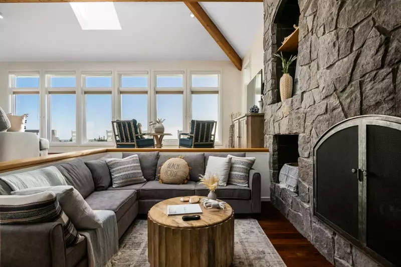 Relax in the living room in front of a cozy fire after a lovely day of Oregon Coast adventures.