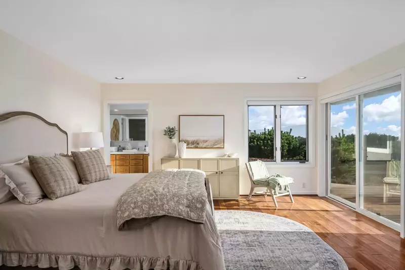 Relax in bed with large windows and an excellent view.