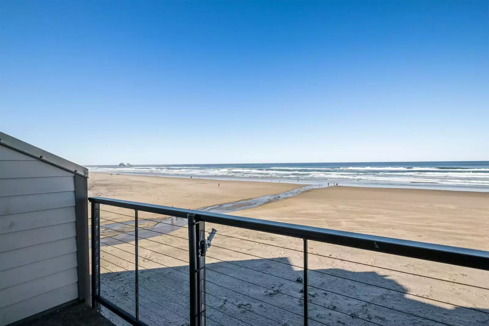 The view of Rockaway Beach is breathtaking. If guests look to the distance they can see the iconic Twin Rocks landmark.