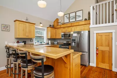 Gorgeous and modern kitchen, including stainless-steel appliances and plenty of cooking equipment.