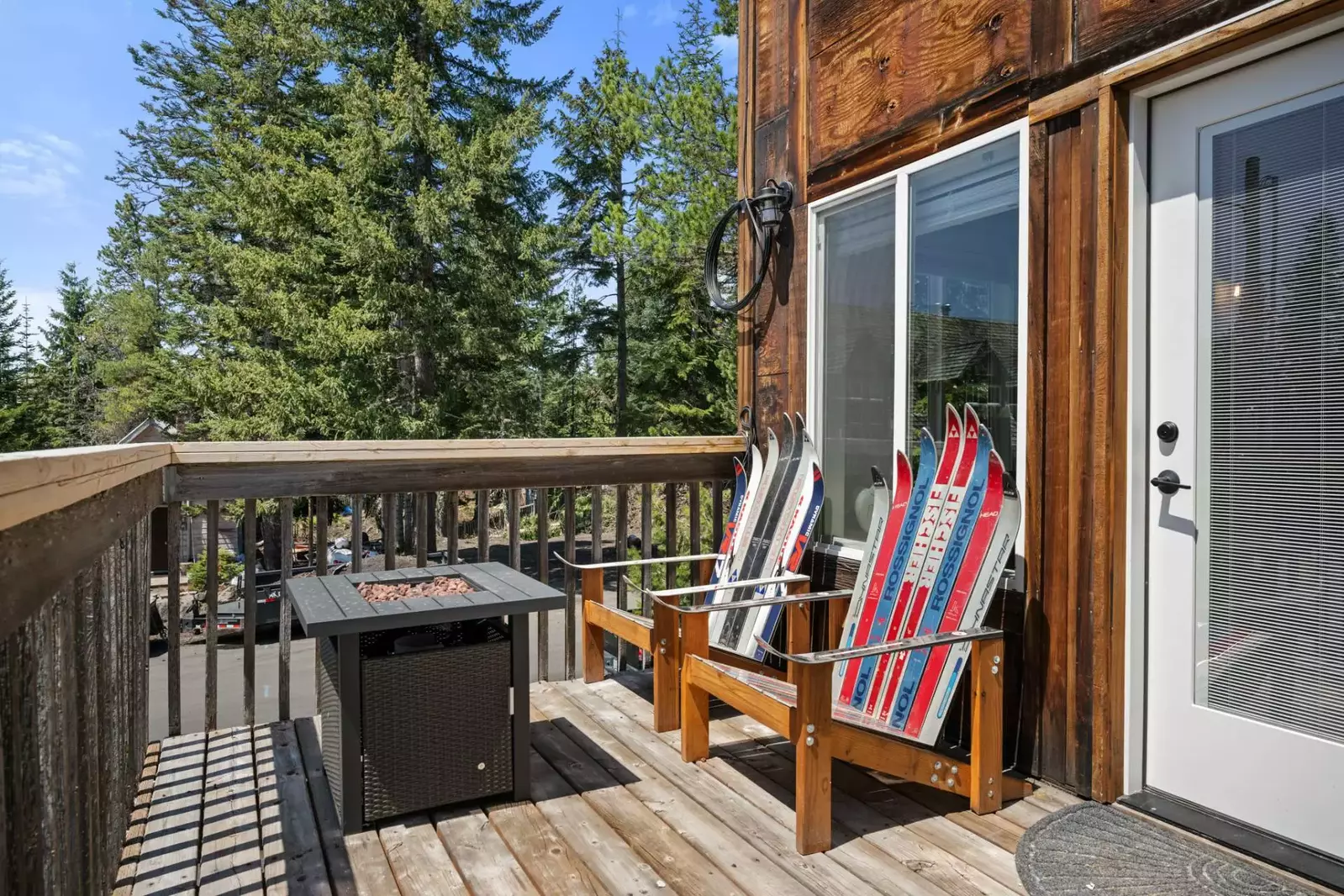 The patio is equipped with our custom ski chairs, fire-table, and of course the BBQ for your grilling experience.