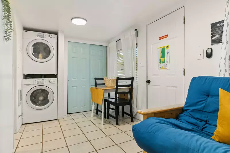 This motel unit has an up to date washing machine and dryer for guest use.
