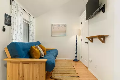 A futon with a smart tv.