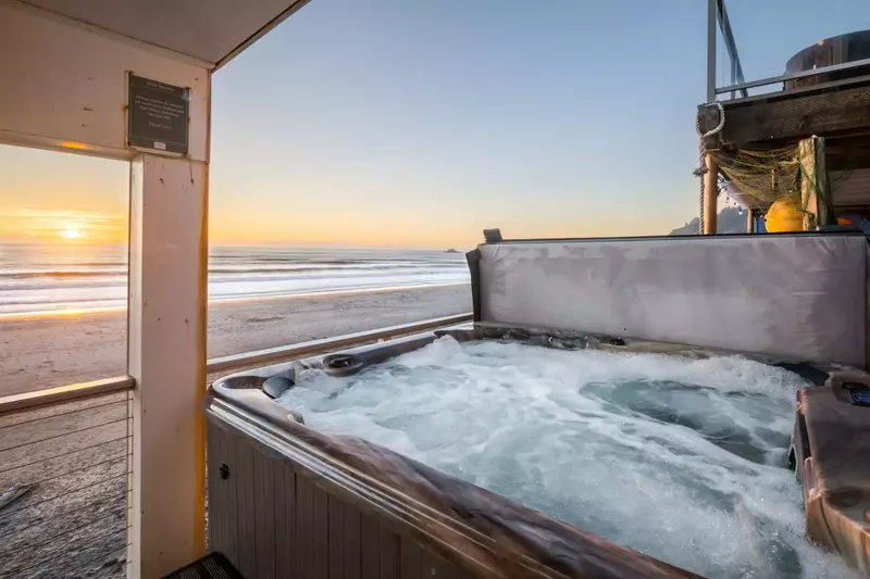 Relax to the sound of the waves while soaking in the hot tub.