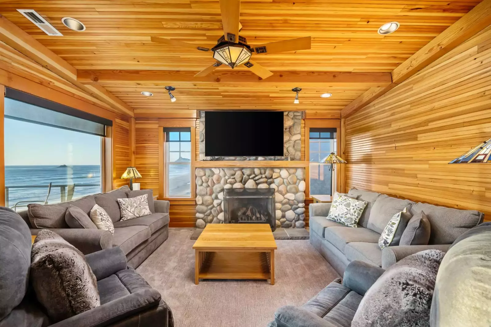 A cozy bonus room gives guests cozy couches, a gas fireplace and 70-inch TV for gathering.