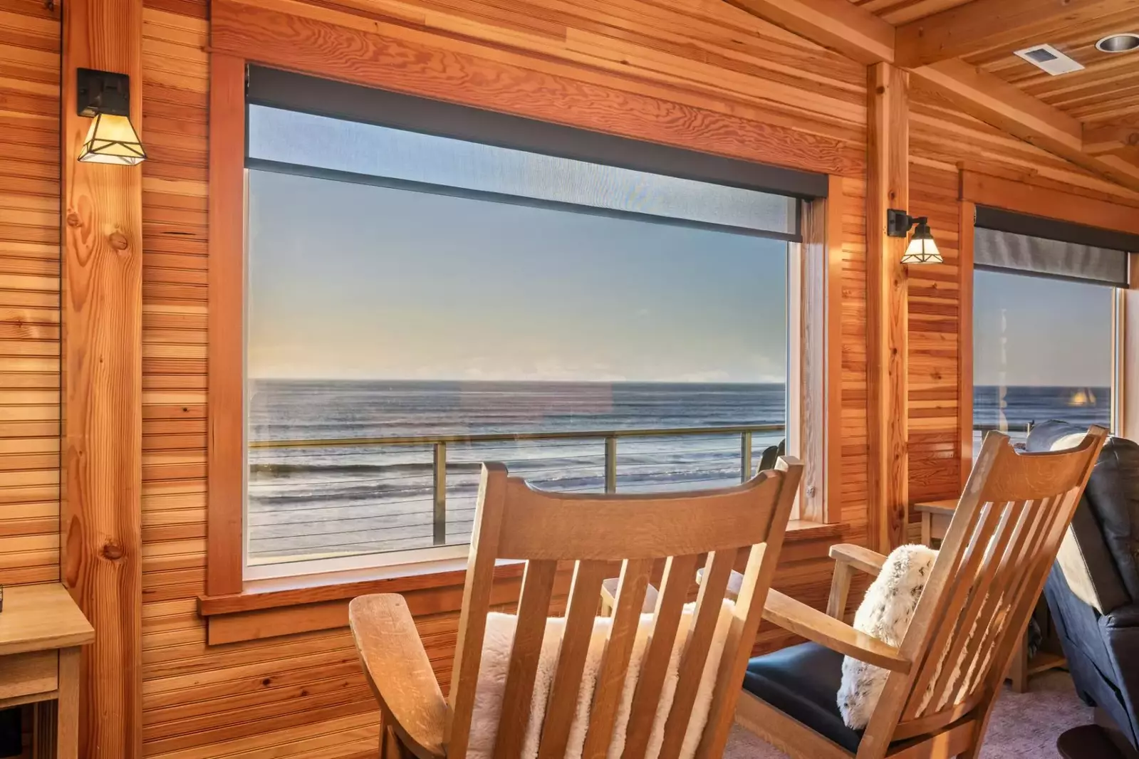 Enter the gorgeous, wood-lined interior of Sandy Shores and advance to walls of windows and a deck with stunning, panoramic views of the sea.
