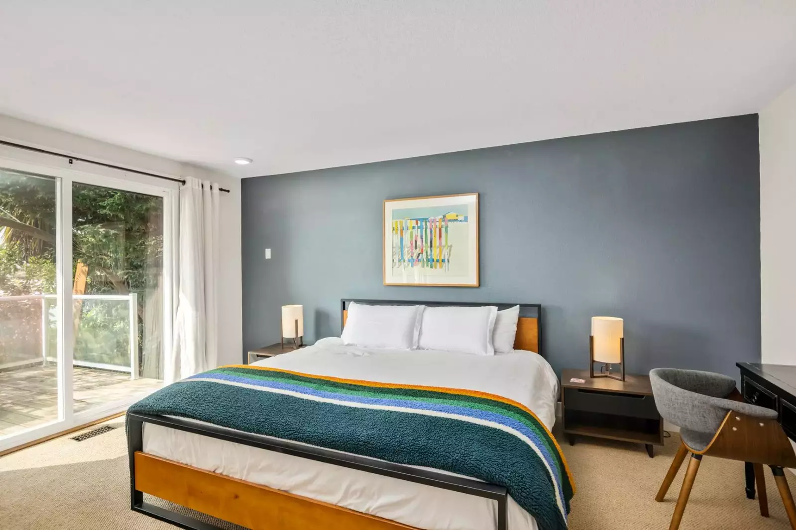 A large and comfy bed with excellent natural light!