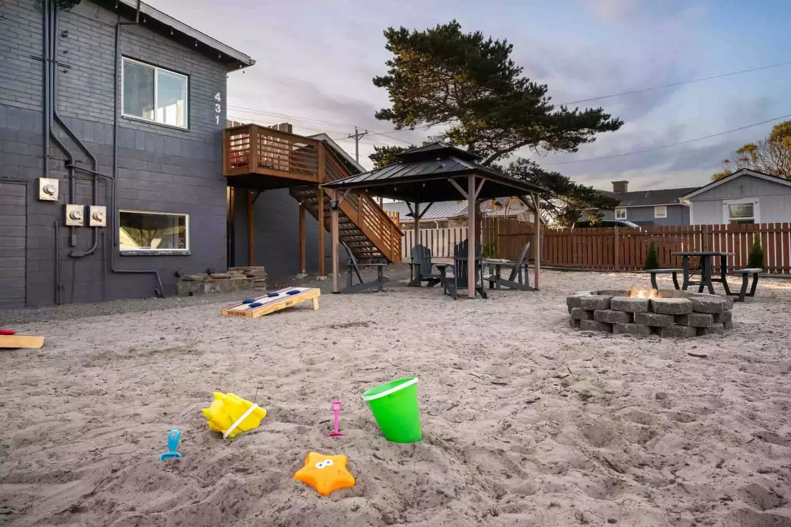 The shared patio area has plenty of seating, games, and a fire pit.