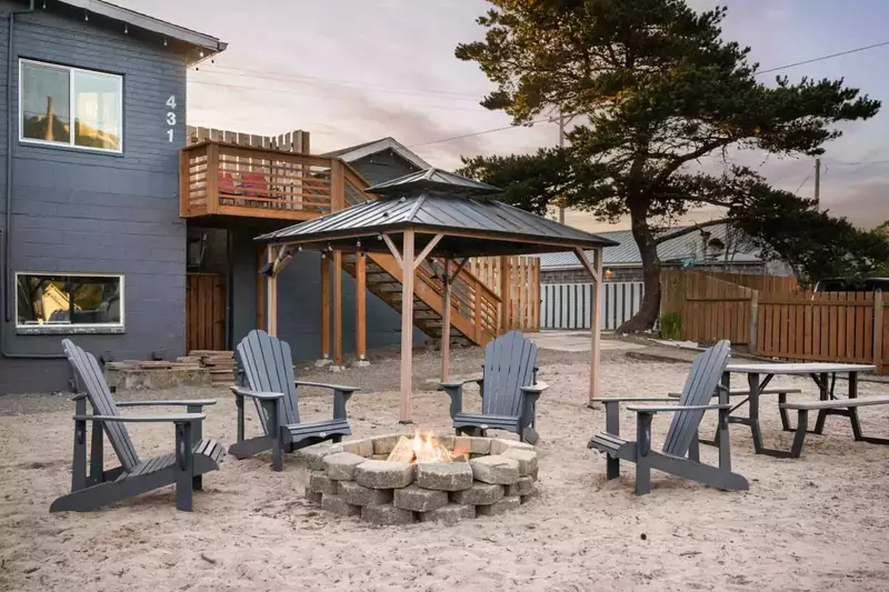 Relax around the communal fire pit after a fun day exploring the coast.