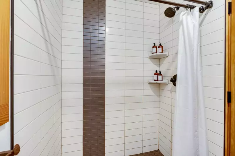 The shower is spacious, up to date, and has excellent water pressure.