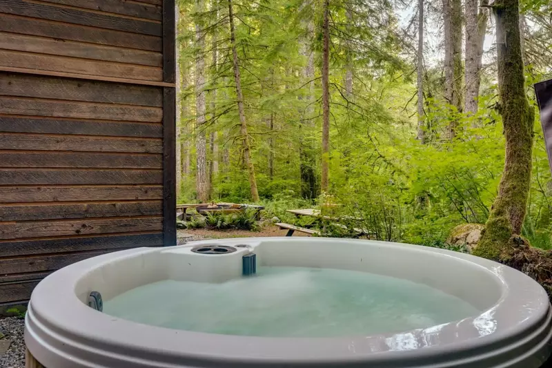 The hot tub is a favorite amenity perfect during warm summers and enchanting winters.