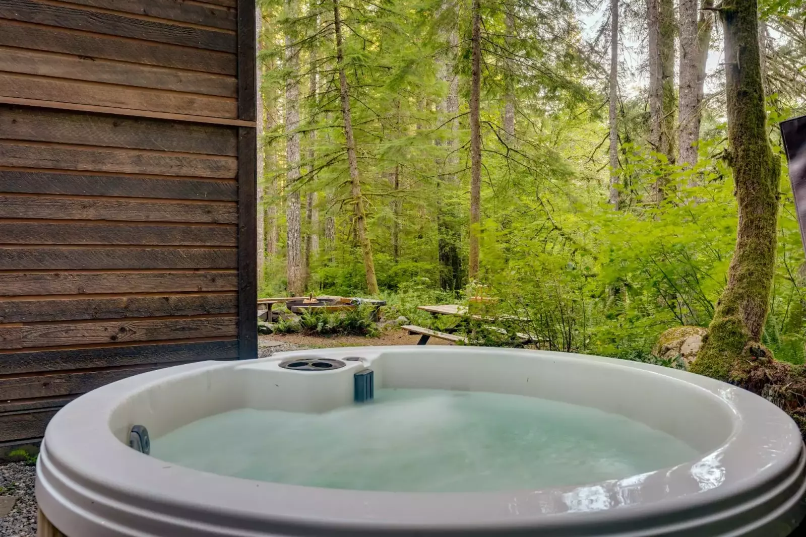 The hot tub is a favorite amenity perfect during warm summers and enchanting winters.