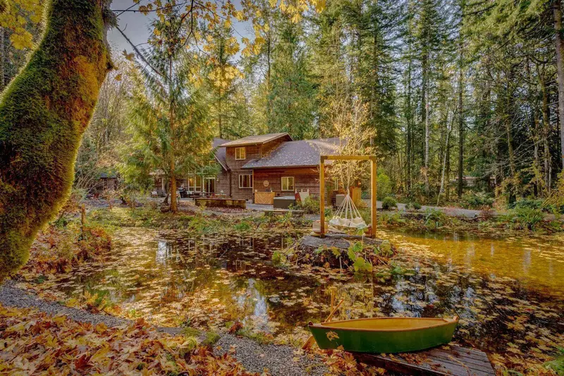 The property does in fact have a pond, and that pond has a canoe, fish, and an island.