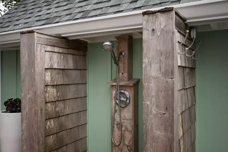 An outdoor shower to wash off in after a fun day on the beach.