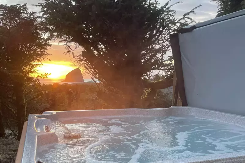 The hot tub is a favorite amenity perfect during warm summers and chilly winters.  It also has a great view of Chief Kiwanda rock.