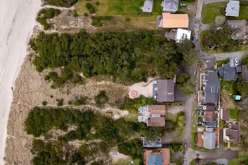 Just steps away from the home, the beach awaits.