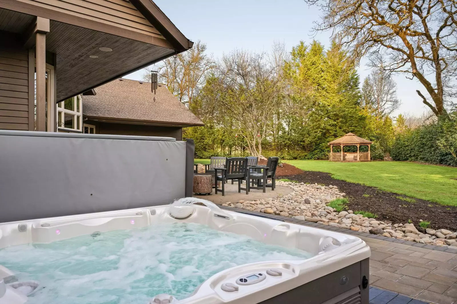 Brand new hot tub overlooking the perfectly manicured backyard.
