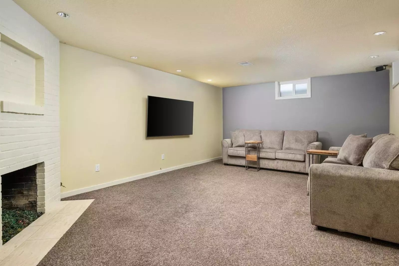 Descending downstairs, you'll find the lower-level lounge and media area.